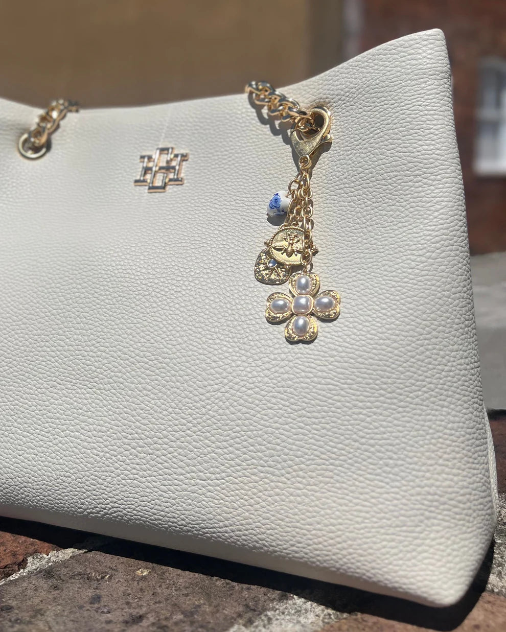 Verona Gold and Pearl Bag Charm Worn Gold